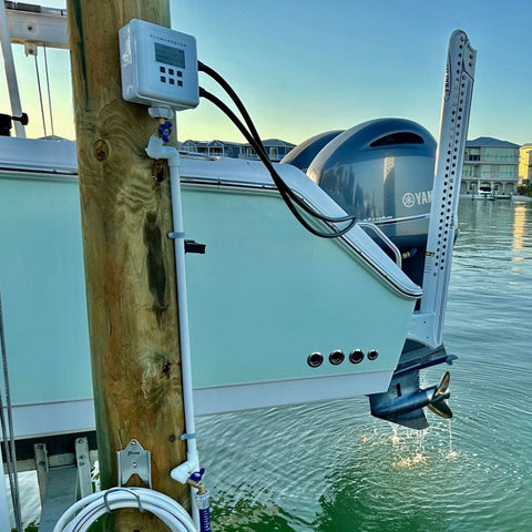 flushmaster mounted on dock connected to dual yamaha motors